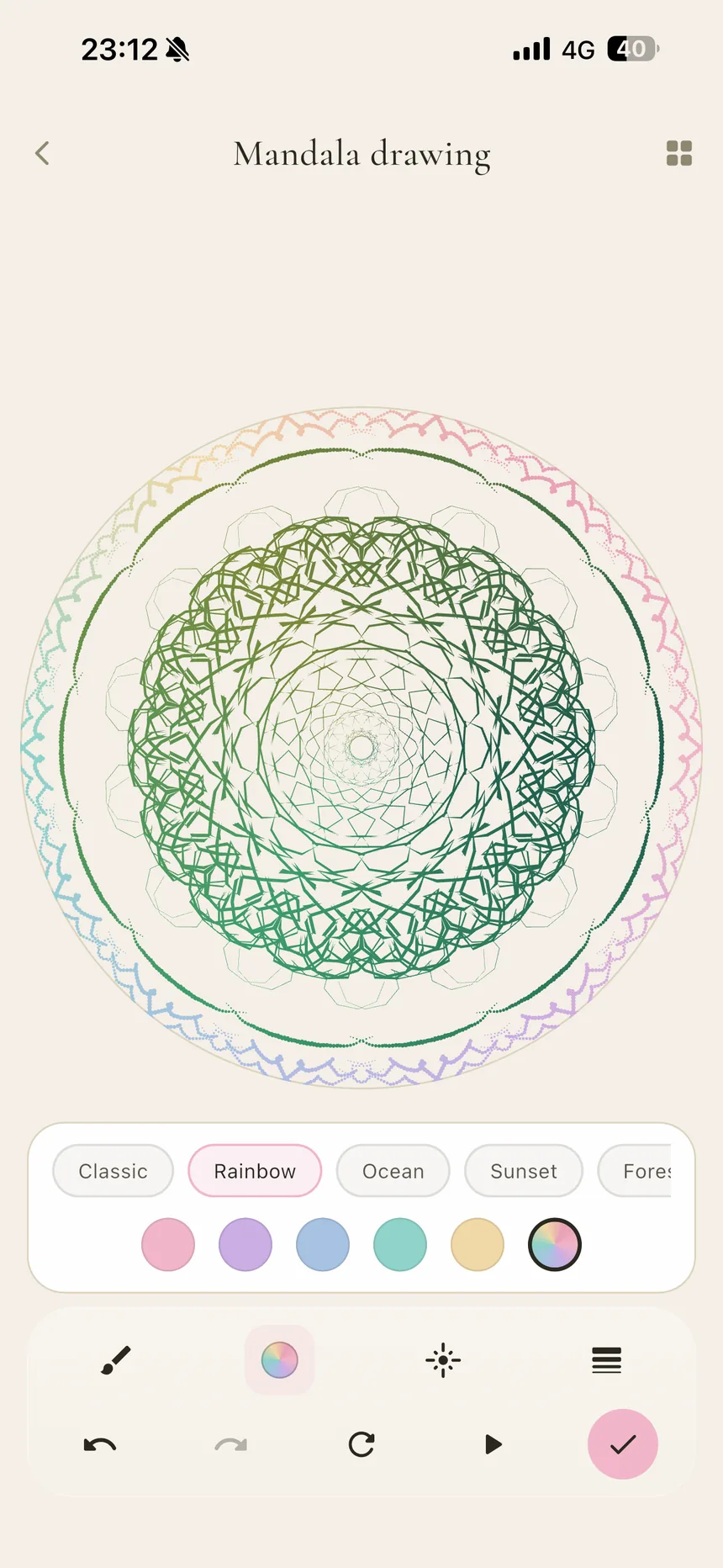 A rainbow mandala mid-drawing in Perla — layered symmetric rings in green, pink, and violet, with color palettes named Classic, Rainbow, Ocean, and Sunset below the canvas